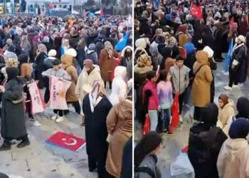 سيدة تسجد على علم تركيا في مؤتمر أردوغان!